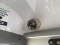 A security camera mounted on the interior ceiling of a 2020 Chevrolet Express