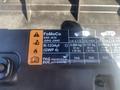 A 2020 Ford Explorer engine bay label showing manufacturer's information and specifications including refrigerant type and oil compatibility