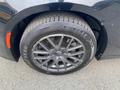 Close-up of the black wheel and tire of a 2019 Dodge Charger featuring a stylish alloy rim and a Goodyear tire with visible tread pattern