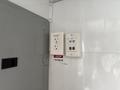 A wall-mounted electrical panel featuring two standard outlets one USB outlet and an inverter label