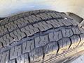 Close-up of a tire on a 2021 RAM Promaster showing the detailed tread pattern and surface texture