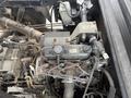 The image shows the engine compartment of a 2011 Kubota RTV 1140 CPX featuring various components such as the engine block hoses and wiring connections