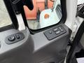 Interior view showing the control panel of a 2012 International 7400 with buttons for window controls and door locks