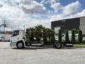 A 2022 Lion Lion6 truck is shown from the side with a sleek design featuring a flatbed and a modern cab without a cargo container
