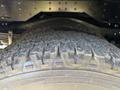 Close-up of a tire on a 2020 Chevrolet Express showing a rugged tread pattern and sidewall detail