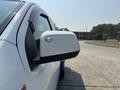 A 2017 Chevrolet Colorado with a focus on the side mirror and part of the vehicle's exterior in white and black colors
