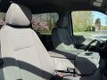 Interior view of a 2021 Ford F-250 SD showing two front seats with a central console between them