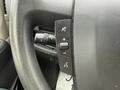 Close-up of the steering wheel controls in a 2020 RAM Promaster including buttons for audio settings and cruise control