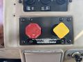 A control panel from a 2008 Peterbilt 340 featuring a red pull valve and a yellow supply button with instructional labels