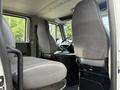 Interior view of a 2008 International 4300 showing two gray fabric seats and a steering wheel with a dashboard visible in between