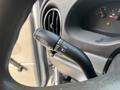 Close-up of the windshield wiper control stalk featuring various settings for wipers and washers in a 2008 Ford Econoline