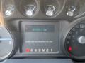 Dashboard of a 2011 Ford F-550 showing various gauges and a digital odometer reading 89330.1 km