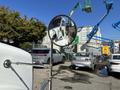 A 2020 Peterbilt 330 truck with a chrome side mirror reflecting the vehicle's interior and part of the surrounding area