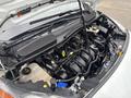 An open hood of a 2019 Ford Transit Connect showing the engine compartment with various components and fluid reservoirs visible