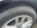 A close-up view of a tire on a 2018 Ford Focus showcasing the tread pattern and alloy wheel design