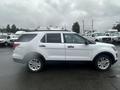 A white 2016 Ford Explorer SUV parked at an angle showing its side profile with aluminum wheels and a black lower trim