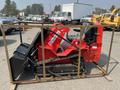 A red 2025 AGT Industrial SDA-140TZ compact track loader with a front bucket and rubber tracks secured in a metal frame
