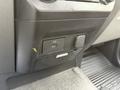 A close-up of a dashboard panel featuring a USB port and a power outlet in a 2017 Ford F-350 SD