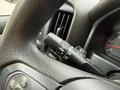 Close-up of the steering wheel and control lever in a 2018 Chevrolet Silverado 1500 showing various settings for wipers and lighting