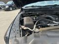 A 2015 RAM 1500 engine compartment showing the air intake and various engine components