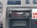 A black and silver ConcertClass audio system with a digital display showing FM radio frequency and various control buttons