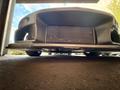 A 1997 Toyota Supra viewed from a low angle showcasing its front end and prominent front grille