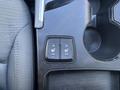 Close-up view of the climate control panel in a 2014 Hyundai Sonata featuring heated seat buttons with high and low settings