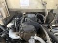 A close-up view of the engine compartment of a 2017 Freightliner MT45 showcasing various components including hoses and a turbocharger