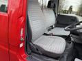 Interior view of a 2001 Toyota Dyna showing two fabric-covered front seats and a steering wheel