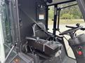 Interior view of a 2019 Madvac LS175 showcasing a driver's seat with seatbelt control panel and steering wheel