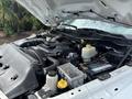 The engine compartment of a 2016 RAM 5500 showcasing the engine components battery and fluid reservoirs
