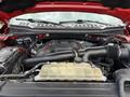 A 2019 Ford F-150 engine with visible components including the air intake system battery and coolant reservoir