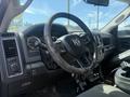 Interior view of a 2016 RAM 5500 showing the steering wheel dashboard and gear shifts with controls and gauges on display