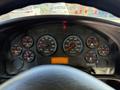 Dashboard of a 2013 International CE300 displaying various gauges including speedometer, tachometer, and indicators for water, volts, and air pressure