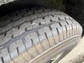 A close-up view of a tire from a 2025 Shuttle Office showcasing its tread pattern and texture