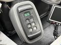 Gear shift panel of a 2013 International Workstar 7500 showing buttons for park reverse neutral drive and mode options along with a digital display