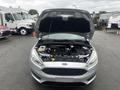 A 2018 Ford Focus with the hood open displaying the engine compartment