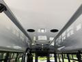 The interior ceiling of a 2020 Chevrolet Express featuring smooth white surfaces and recessed lighting with black ventilation grilles and a light fixture