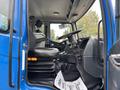 Interior of a 2017 Autocar Xpert featuring a driver's seat a steering wheel and a dashboard with controls and storage compartments