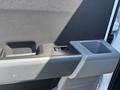 Interior door handle and cup holder of a 2023 Ford F-350 SD