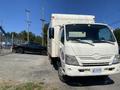 A 2014 Hino 195 box truck with a white exterior is parked in the foreground