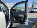 A 2017 Chevrolet Colorado with the driver's door open revealing the interior and door panel details