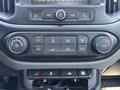 The control panel of a 2017 Chevrolet Colorado featuring climate controls audio settings and other function buttons