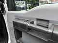 Close-up view of the door handle and controls of a 2013 Ford F-250 SD