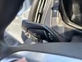 A close-up of the turn signal lever from a 2019 Ford Transit 350 showing directional lights and other controls