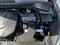 A detailed view of the engine compartment of a 2017 Kia Sorento highlighting the engine block battery and various components in a neatly organized layout