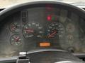 Close-up of a 2006 International 4200 dashboard showing various gauges for water, RPM, speed, fuel, and voltage