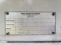Metal identification plate from a 2010 Freightliner M2 106 displaying serial number capacity size and material details