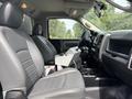 Interior of a 2016 RAM 5500 with grey leather seating and a central console featuring controls and storage compartments