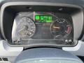 Dashboard of a 2012 Mitsubishi Fuso FE showing speedometer fuel gauge and display for DPF level with various indicators and a digital odometer reading 124862